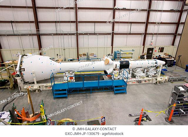 The fully-assembled launch abort system for the Pad Abort-1 (PA-1) flight test is in the final integration and test facility during preparations for the test at...