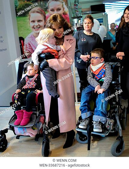 Dame Joan Collins joined by some of the supported families opens Shooting Star Chase’s boutique charity in Fulham. She has donated a number of exclusive items...