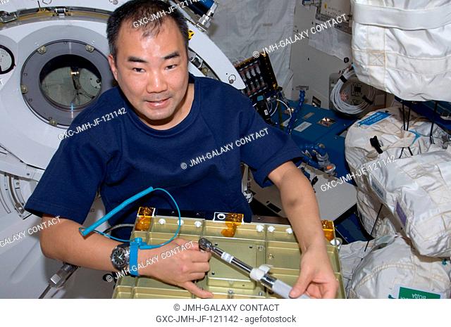 Japan Aerospace Exploration Agency (JAXA) astronaut Soichi Noguchi, Expedition 22 flight engineer, works with hardware in the Kibo laboratory of the...