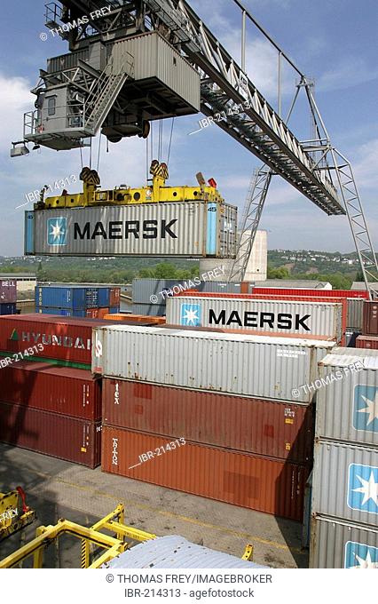 A gantry crane loading nestable containers .Koblenz, Rhineland-Palatinate, Germany