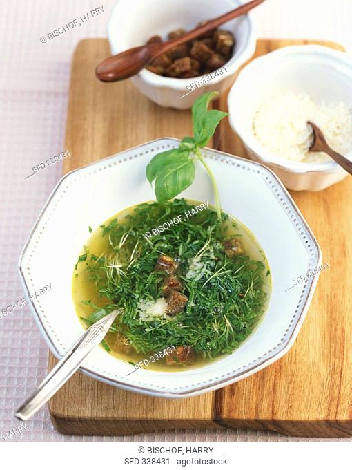 Herb soup with olive oil, croutons and Parmesan