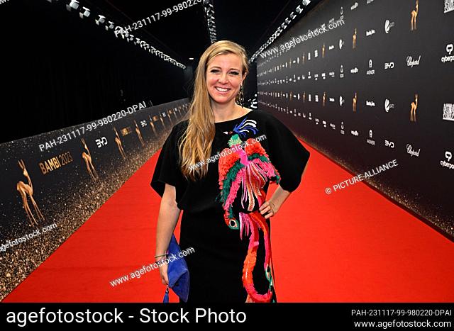 17 November 2023, Bavaria, Munich: Presenter Nina Eichinger walks across the empty red carpet after the Bambi Awards at the Bavaria Film Center