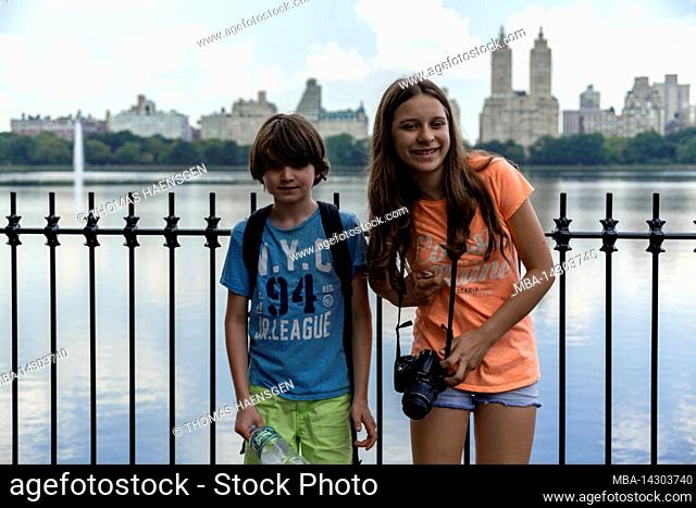 Central Park West, historic district, New York City, NY, USA, Young Boy and Girl next to the biggest Lake in Central Park