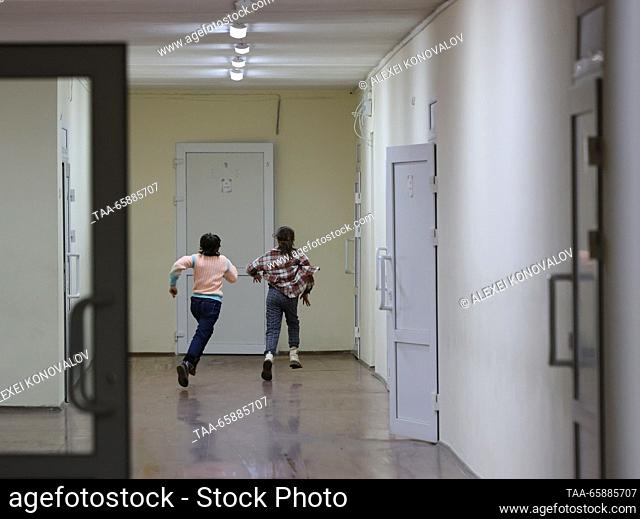RUSSIA, ZAPOROZHYE REGION - DECEMBER 18, 2023: Kids run in a hall at school No 4 in the town of Pologi. The school has 440 students who come from nearby...