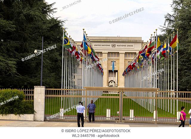 Tourists taking pictures in Court of flags at the United Nations Office at Geneva, UNOG, Palais des Nations, Geneva, Switzerland
