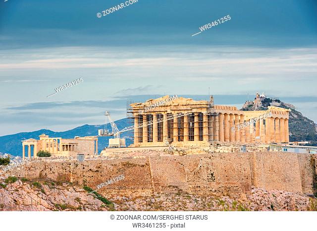 Ancient Acropolis in rays of sunset. Athens Greece. Copyspace