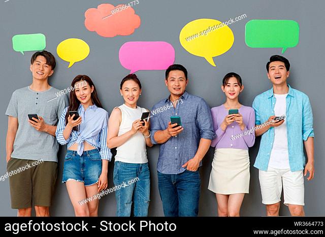 Young people use mobile phone chat software to communicate