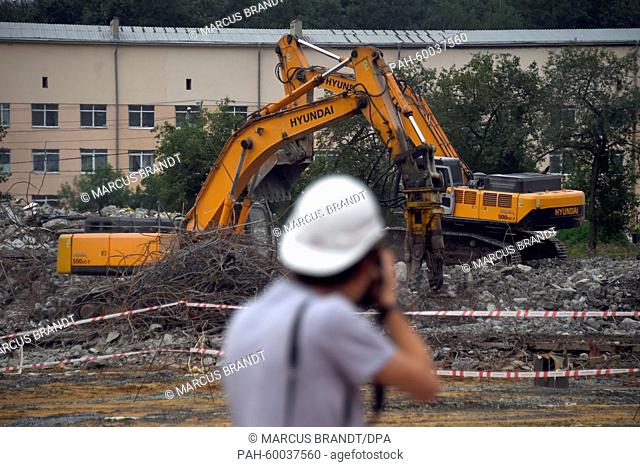 In the backgrounds cranes are demolishing the old stadium at a building site at the to-be soccer world cup stadium in Jekaterinburg, Russia, 12 July 2015