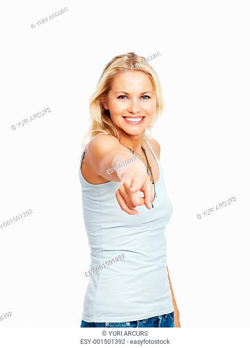 Portrait of a pretty young lady smiling while pointing at you isolated on white background