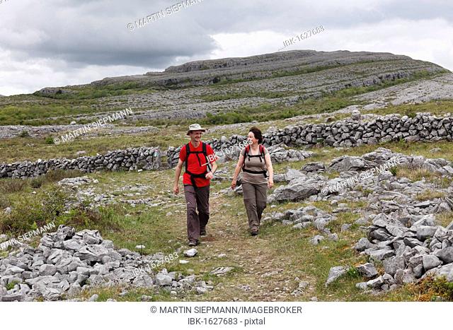 Hikers in Burren National Park, County Clare, Ireland, Europe