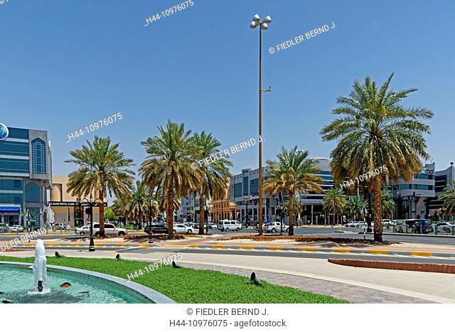 Asia, United Arab Emirates, UAE, Abu Dhabi, Al Ain, Zayed Were sultan Street, 118th Street, crossroad, intersection, traffic light, palms, fountains