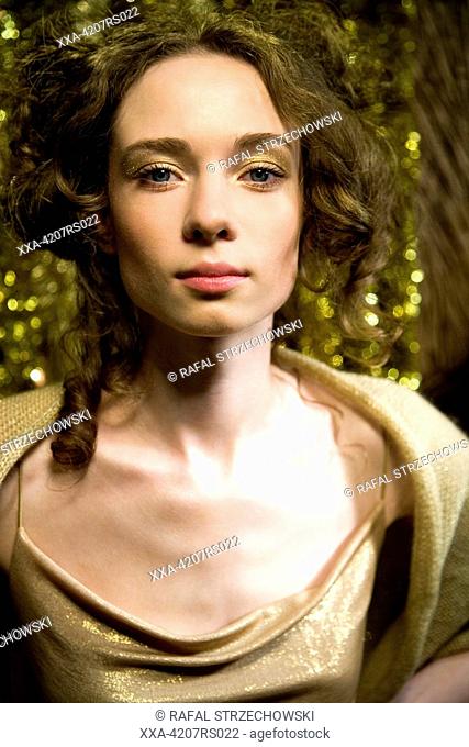 portrait of a woman in golden makeup