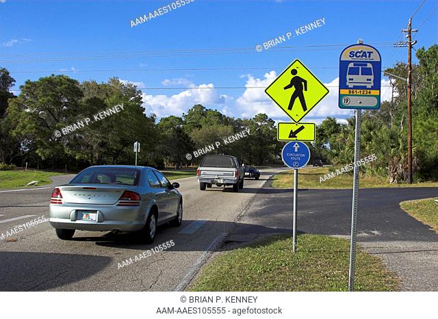 Road Signs for Hurricane Evacuation Route, Pedestrian Crossing, and Bus Stop (Sarasota County Area Transit System), North Port, Florida