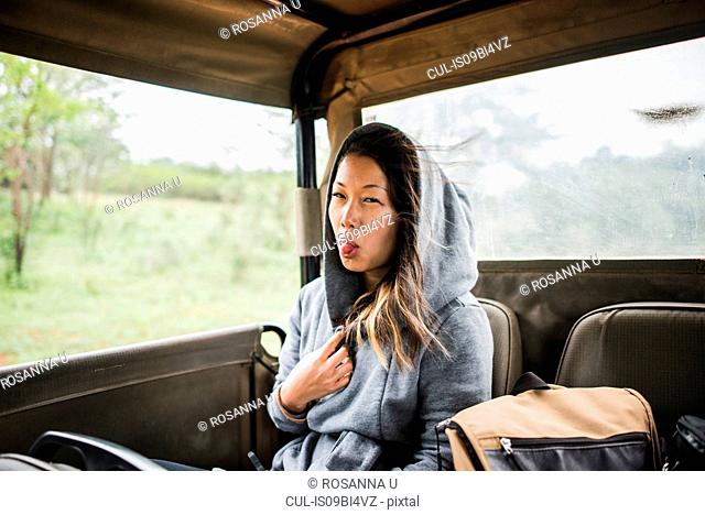 Young female tourist on tour truck, portrait, Kruger National Park, South Africa