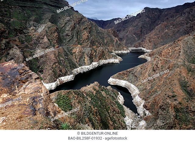 The scenery with a reservoir with Acusa in the mountains in westen of the island grain Canaria on the Canary islands in the Atlantic, Spain