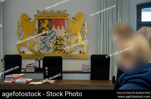 06 October 2023, Bavaria, Memmingen: A man and a woman stand in the dock at the regional court. As part of the criminal investigation into the Allgäu animal...