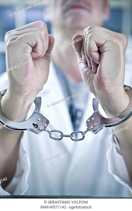 doctor with handcuffs