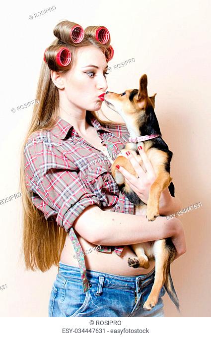 kissing puppy: portrait on beautiful blond young woman pin up sexy girl  with curlers on her head..., Stock Photo, Picture And Low Budget Royalty  Free Image. Pic. ESY-034447631 | agefotostock