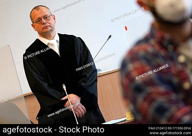12 April 2021, Hamburg: Presiding District Court Judge David Vymer.stands in the courtroom at the Criminal Justice Building at the start of the trial