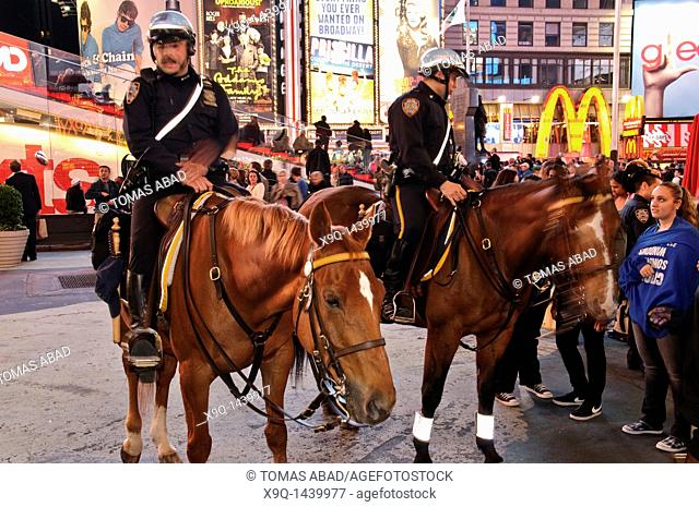 Times Square, 42nd Street, New York City, 2011, NYPD on horseback, a popular tourist attraction