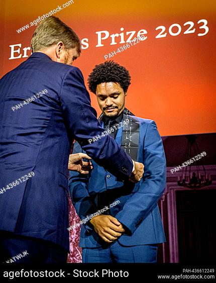 AMSTERDAM, NETHERLANDS - NOVEMBER 28: Comedian Trevor Noah receives the Erasmus Prize presented by King Willem-Alexander of The Netherlands at the Royal Palace...