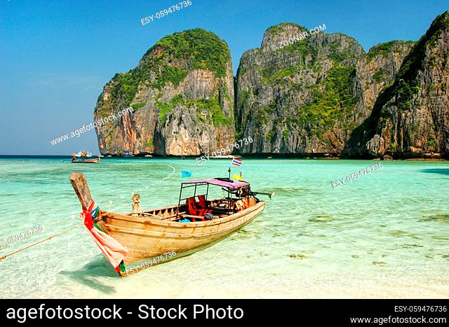 Longtail boat anchored at Maya Bay on Phi Phi Leh Island, Krabi Province, Thailand. It is part of Mu Ko Phi Phi National Park