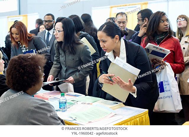 Job seekers attend the CUNY Big Apple Job and Internship Fair at the Jacob Javits Convention Center in New York. The US Labor Department reports new claims for...