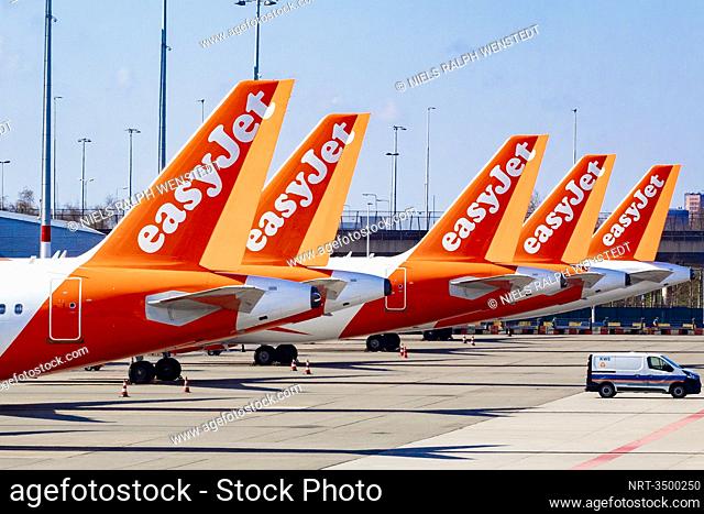 SCHIPHOL - Airplanes of EasyJet parked at Schiphol Airport. Closed gates and departure halls at Schiphol during times of the corona virus