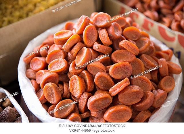 Close-up shot of a bag full of dried apricots