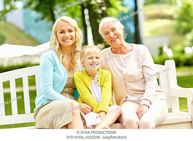 woman with daughter and senior mother at park