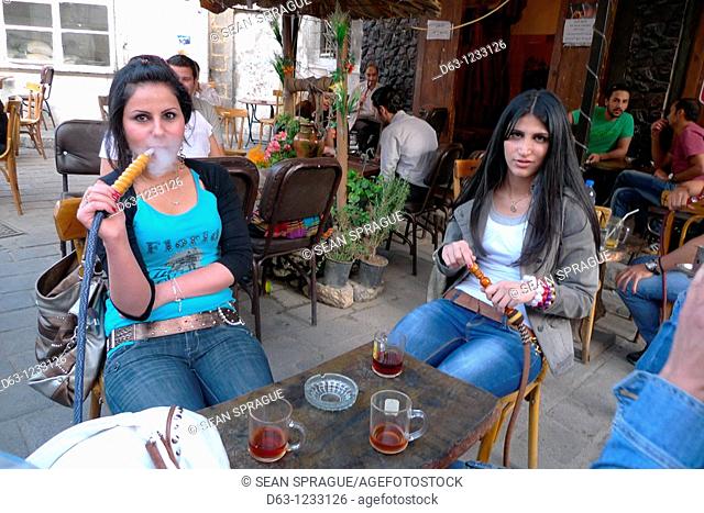 Cafe with young women smoking sheesha pipes, Damascus, Syria