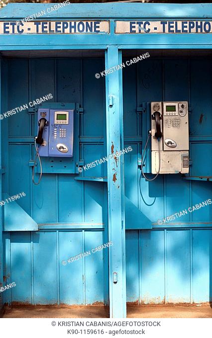 Vertical image of blue, public telephone boxes with two telephones, nobody around, Addis Ababa, Ethiopia, East Africa