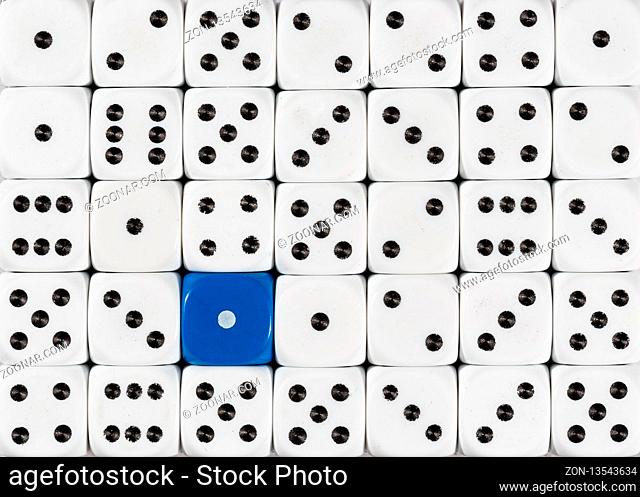 Pattern background of random ordered white dices with one blue cube