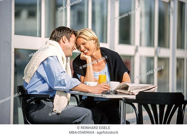 Young couple in the street cafe