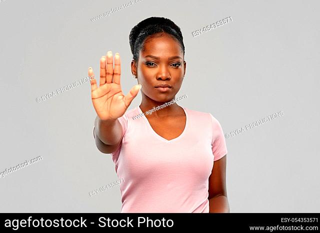 african american woman over grey background