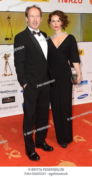 German actor Ulrich Noethen (L) and his girlfriend Friederike Wagner arrive for the 48th Golden Camera award ceremony in Berlin, Germany, 2 February 2013