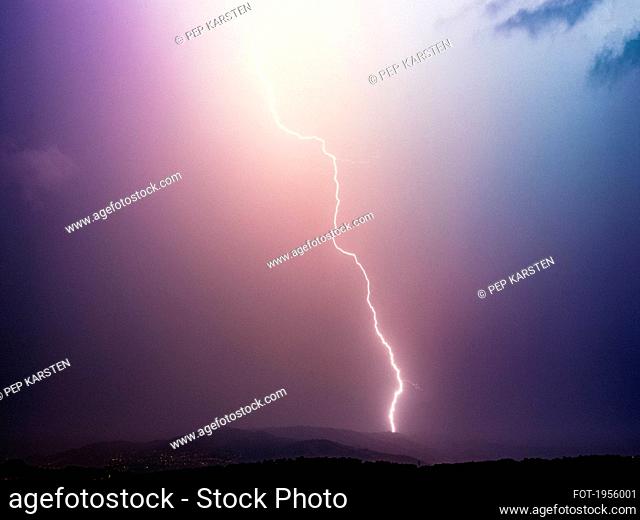 Lightning bolt in majestic stormy sky, Tanneron, French Riviera, France
