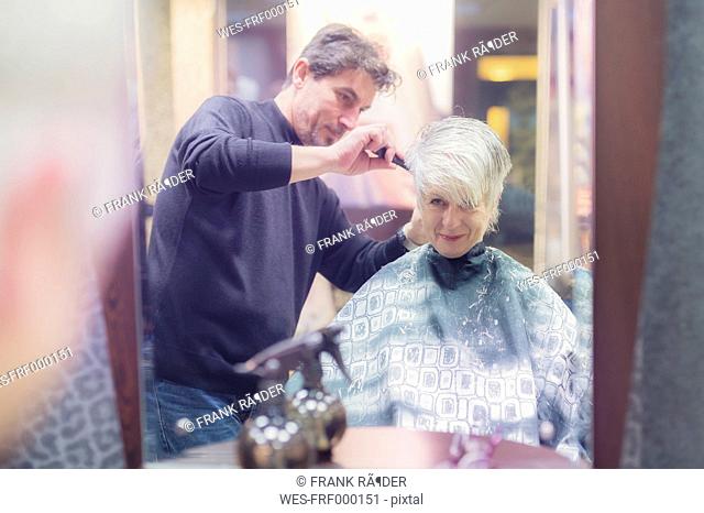Senior woman getting new hair cut