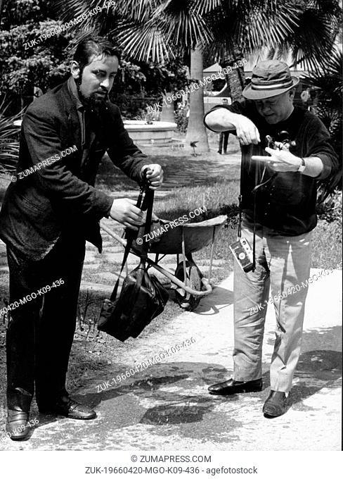 Apr. 20, 1966 - Rome, Italy - Actor MICKEY ROONEY was born on September 23, 1920 in Brooklyn, New York, pictured helping a photographer remove his gear after...