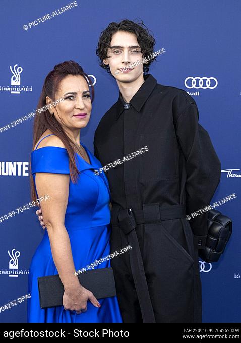 09 September 2022, Berlin: Eren M. Güvercin comes with his mother to the German Drama Award 2022 ceremony. Photo: Monika Skolimowska/dpa