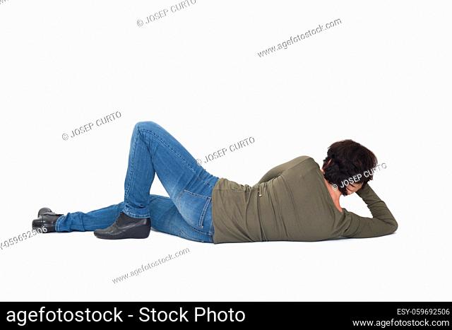 rear view of a woman lying on the floor hand on head on white background
