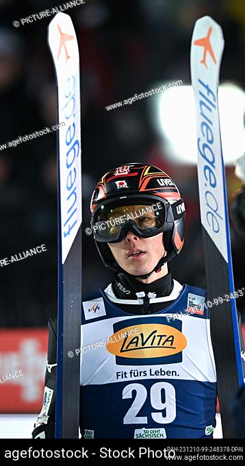 10 December 2023, Saxony, Klingenthal: Nordic skiing/ski jumping, World Cup, large hill, men, 2nd round. Junshiro Kobayashi from Japan reacts after his jump