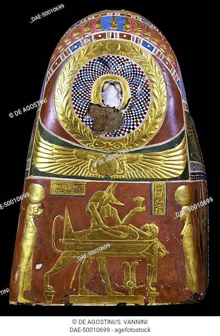 Anubis in the throes of performing the ritual of embalming, decorative detail of a male funeral mask, painted and gilded cartonnage, from Meir