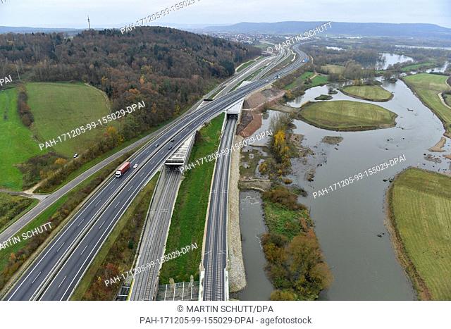 The new high speed railway tracks stretch into the distance alongside the 73 motorway and the course of the River Main near Breitenguessbach, Germany