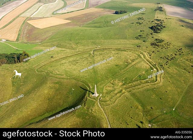 CHERHILL DOWN, Wiltshire. General aerial view showing the obelisk, hillfort (Oldbury Castle) and white horse