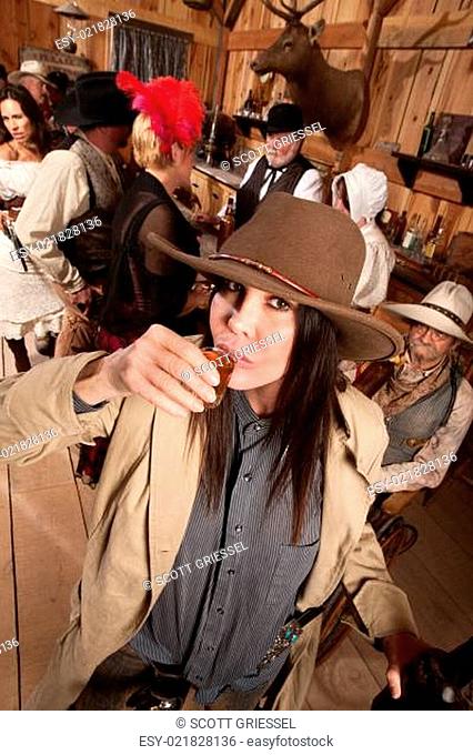 Woman in Cowboy Hat Drinks Whiskey