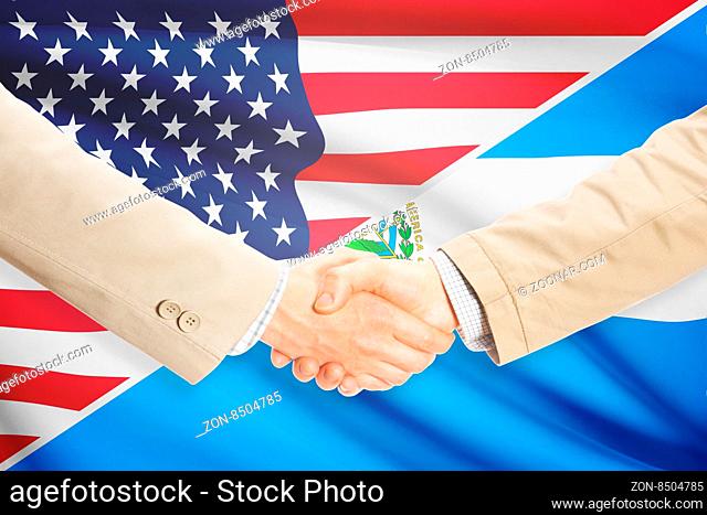 Businessmen shaking hands - United States and El Salvador