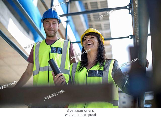 Two engineers inspecting construction site