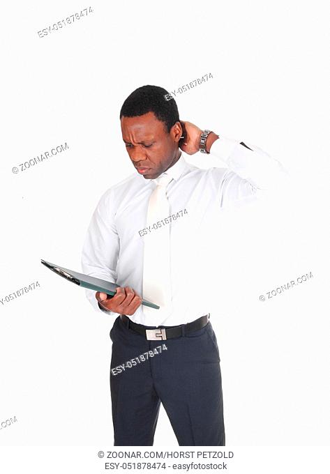 A young handsome African American business man standing in a white shirt and tie, scratching his head, isolated for white background
