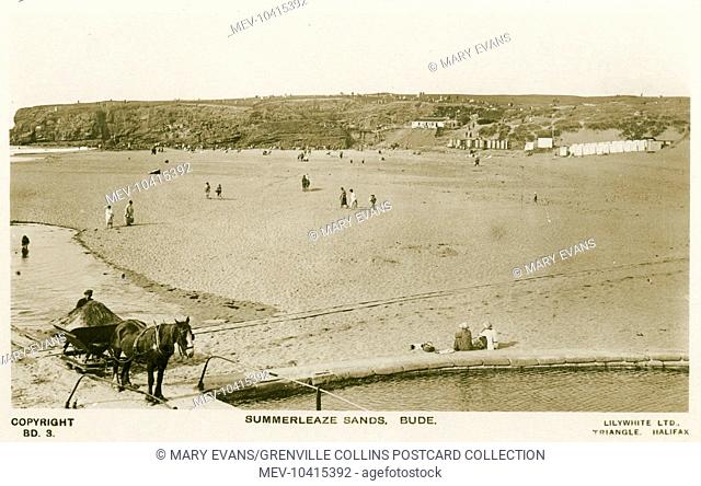 Summerleaze Sands, Bude. A workman collects sand in a small wagon on a rudimentary railway running across the beach, pulled by a horse